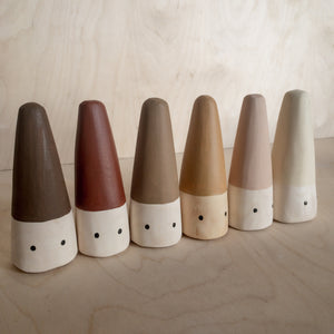 Hand carved Cone people